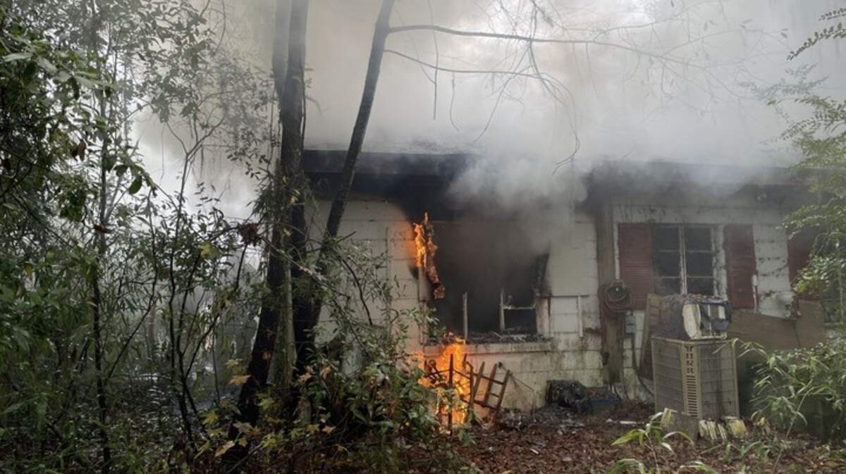 A space heater is the suspected cause of a fire that heavily damaged a home in Port Royal Sunday and also left a woman living there with burn injuries that required hospital treatment.