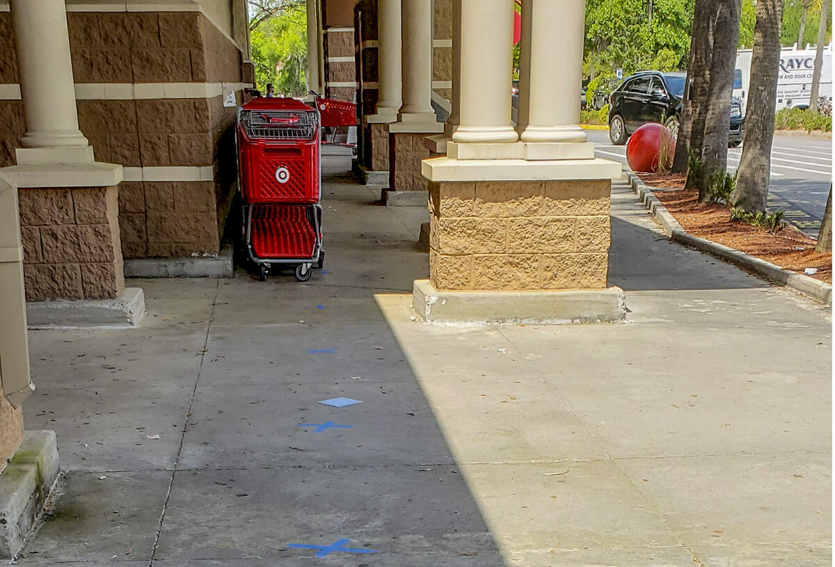 Tape on the the sidewalk outside of Target at Kitties Crossing in Bluffton on Wednesday, April 8, 2020, mark spacing for shoppers to keep social distance if too large of crowds come to the big box retailer. On Monday, S.C. Governor Henry McMaster placed an executive order that essential businesses must limit the number of customers based on the square footage of their facility or 20% of the occupancy, whichever is less, in hopes of stemming the spread of the coronavirus.
