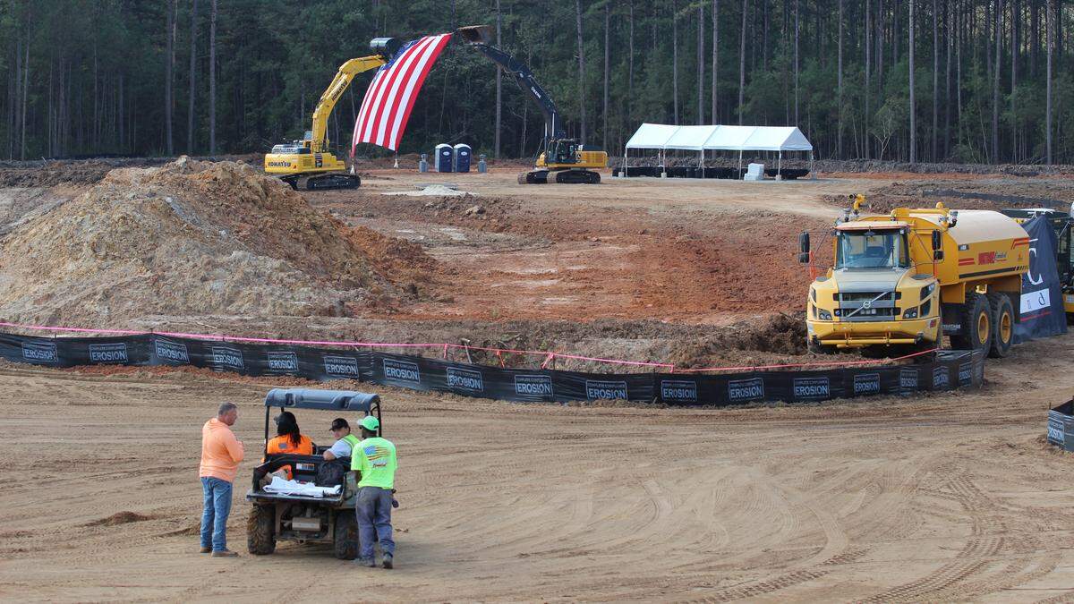 Workers chat at the construction site of Carolina Station after the groundbreaking ceremony on Oct 16, 2025.