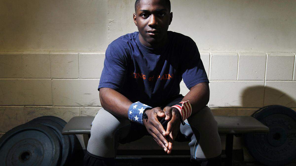 Beaufort's C.J. Cummings sits for a portrait at the Beaufort Middle School weight room on December 10, 2014.  Cummings will travel to compete in the American Open. The 14-year-old this year set an American record for his 62-kg weight class. He now competes at 69 kg.