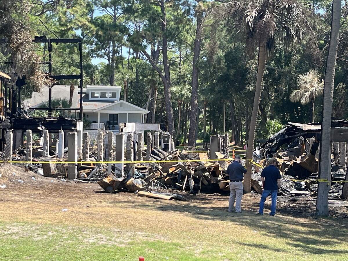 Insurance adjusters inspect houses Monday on Bonito Road on Fripp Island. Three houses were destroyed in a Saturday fire.