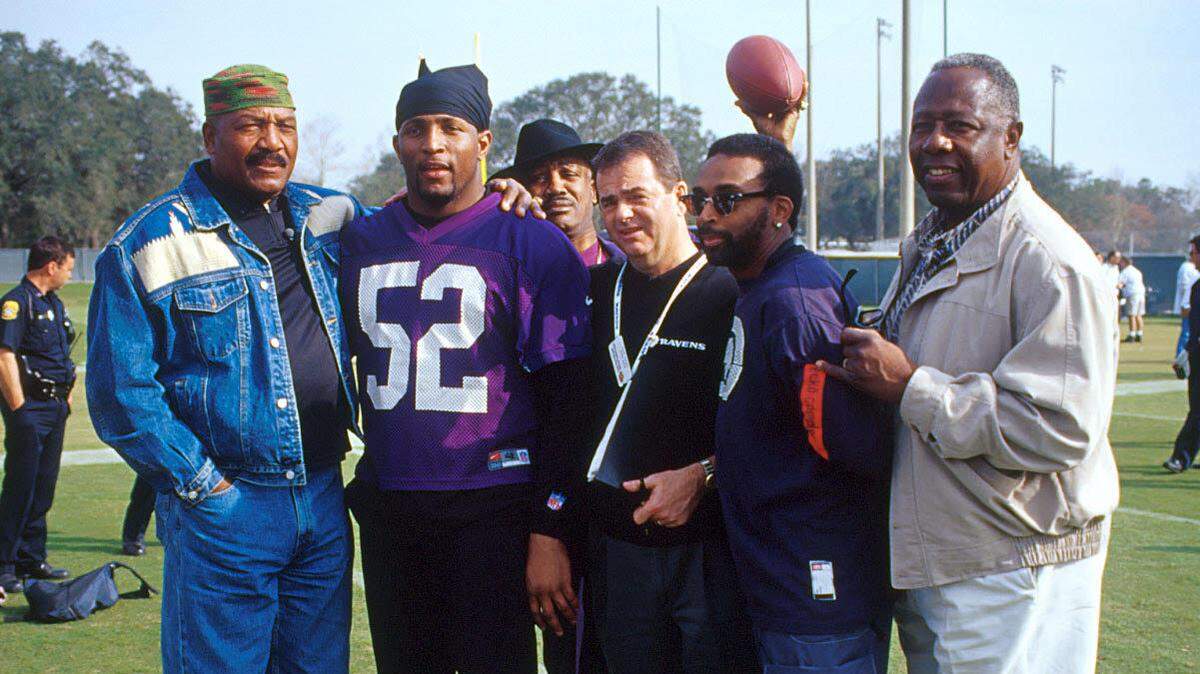 This photo, taken in 2001, hangs on the wall in Kevin Byrne’s den at his Hilton Head Island home. It was taken at Friday practice before Super Bowl XXXV. From left are NFL Hall of Famers Jim Brown and Ray Lewis, world heavyweight champ Joe Frazier, Kevin Byrne, director Spike Lee, and baseball legend Hank Aaron.