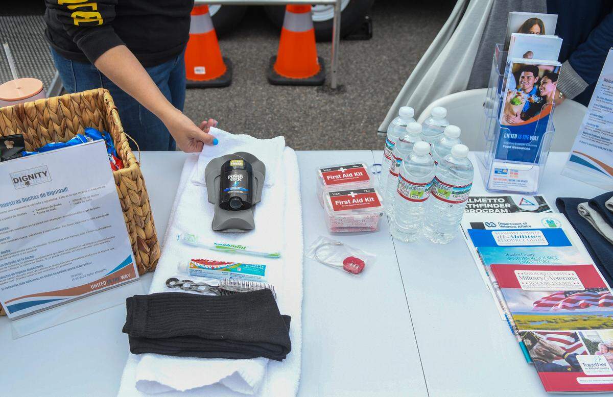 Each person will receive a shower roll that includes a bath mat, towel, wash cloth, shower shoes, a brush, deodorant and a toothbrush and toothpaste. While showering, people will be able to lock their possessions in a bin with a combination lock, middle of photo, that they can take with them.
