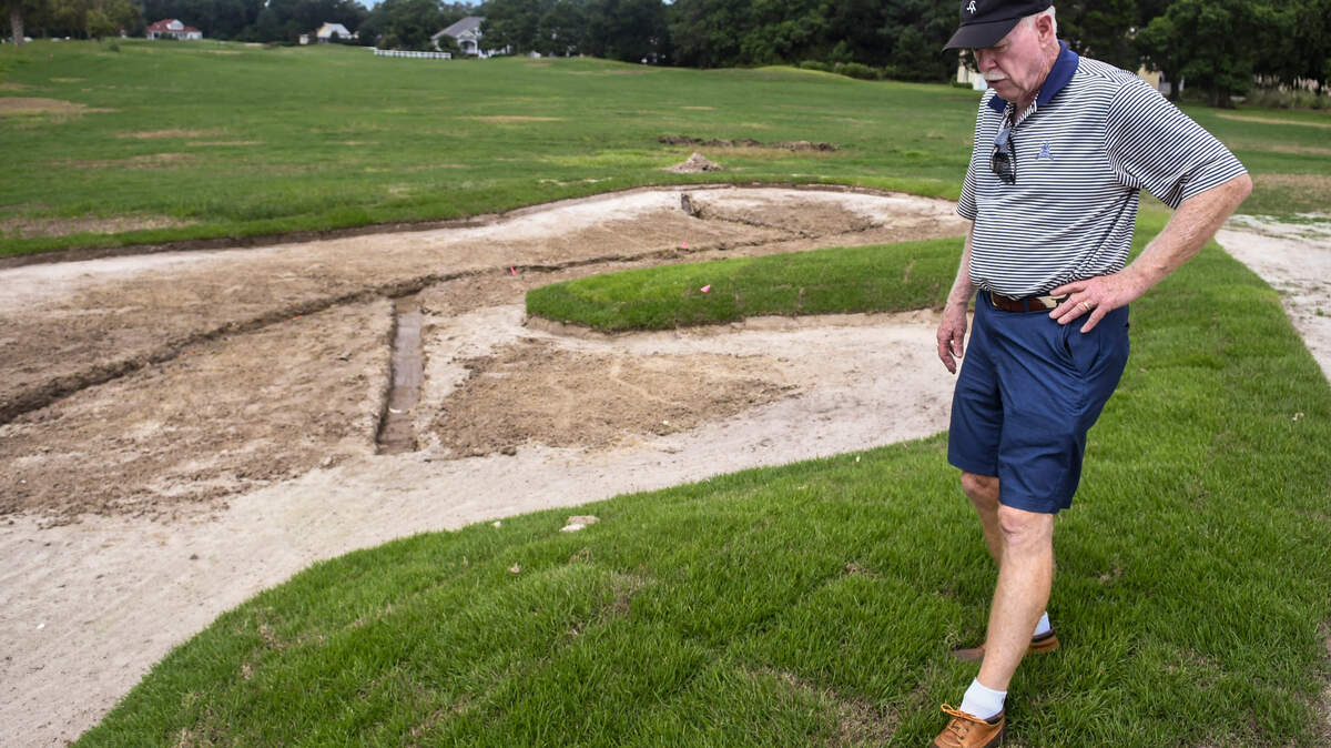 Golf course architect John LaFoy pushes on newly laid sod with his foot near the ninth green on Thursday, Sept. 1, 2022, at Cat Island Golf Club on Cat Island. The course is officially reopening this weekend.