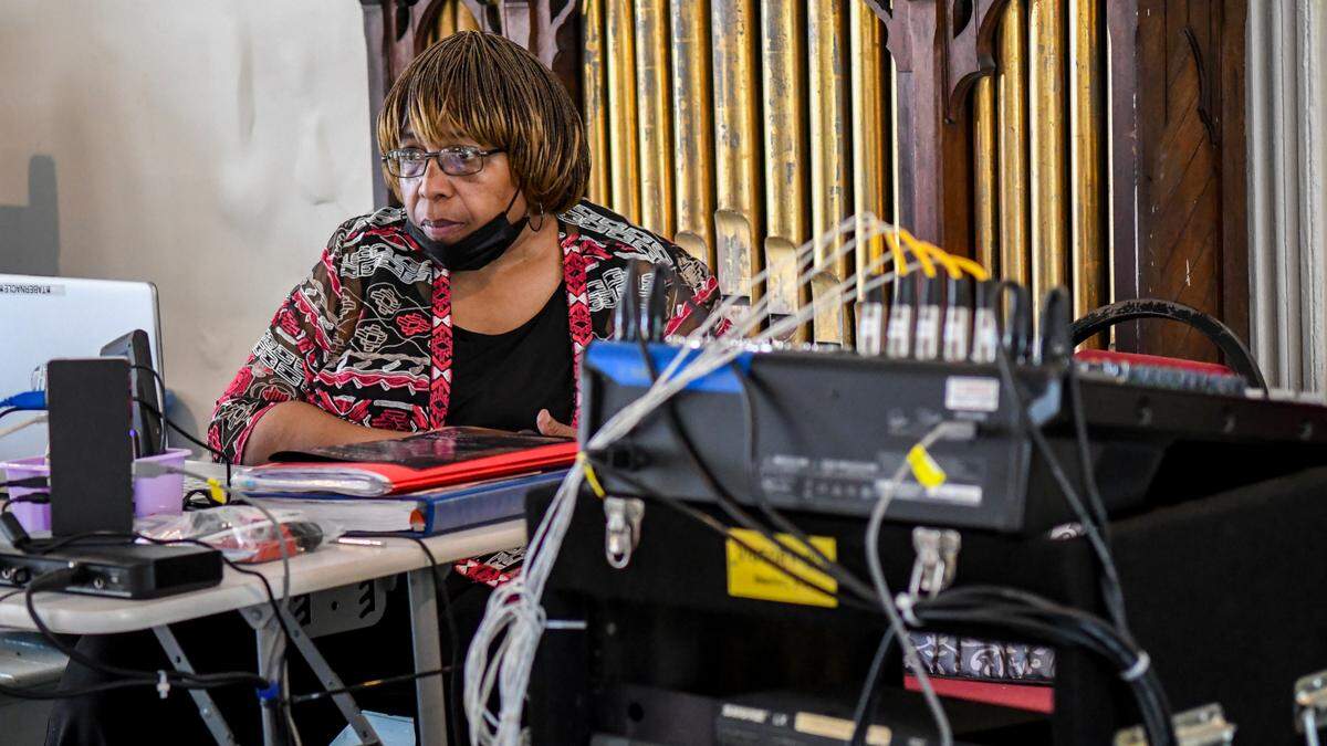 Savanah French runs the livestream for the funeral of Rev. Kenneth Hodges on May 3, 2025, in the balcony of Tabernacle Baptist Church in Historic Downtown Beaufort.