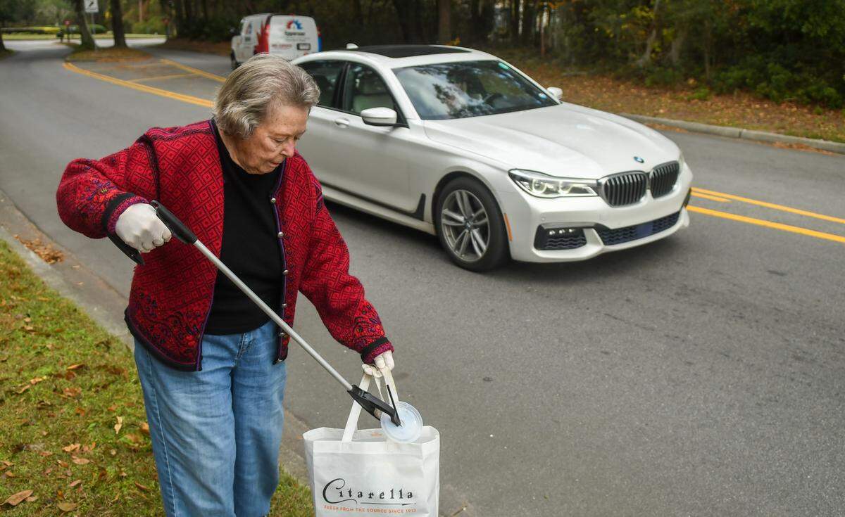 On her morning walks Mimi Finger, 90, brings along a shopping bag and a grabber to pick up litter along Gardner Drive as photographed on Friday, Dec. 8, 2023 on Hilton Head Island.