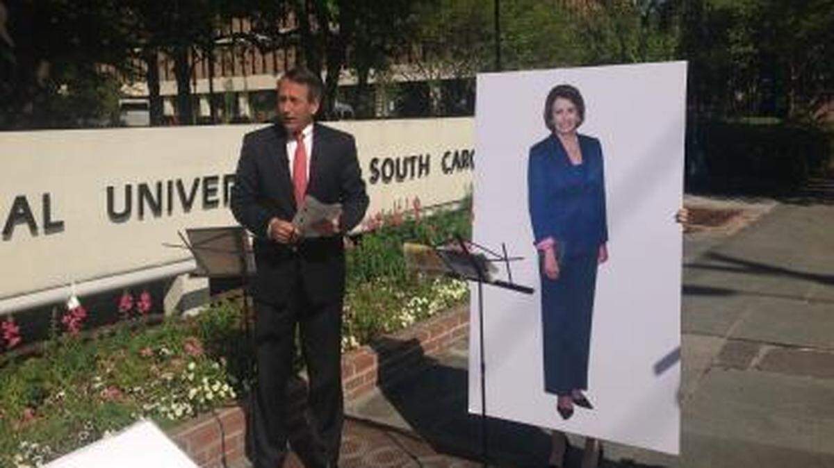 Mark Sanford tweeted this photo of himself and a cutout of Nancy Pelosi he's using as a stand-in for Elizabeth Colbert Busch in what would have been a debate.