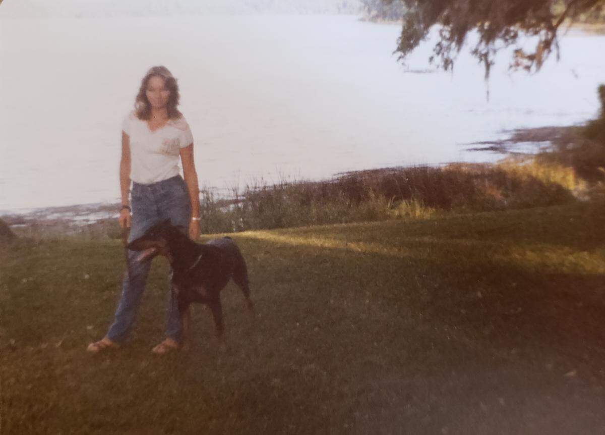 Susan Weed, pictured with Kobi, her trained Doberman Pinscher bought to protect her after she was raped and her boyfriend murdered by an unknown man on Jan. 5, 1980 just seven-tenths of a mile from her home.