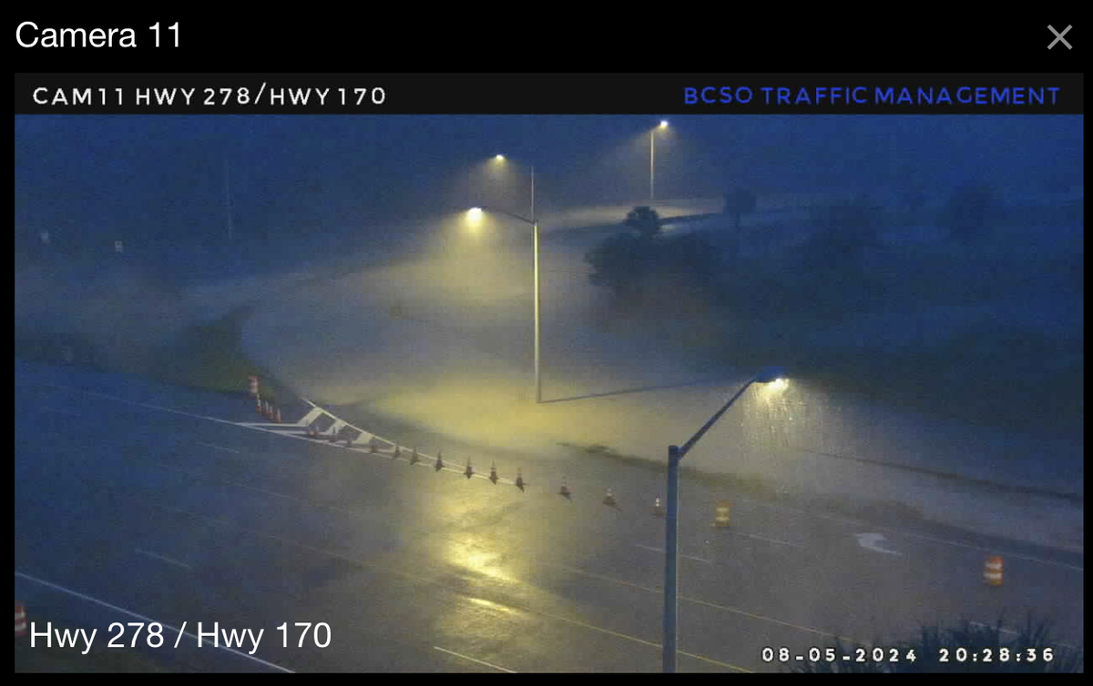 The on-ramp from Okatie Highway to Fording Island Road can be seen inundated with water around 8:30 p.m. Monday night. Officials closed the ramp about two hours earlier as heavy rains associated with Tropical Storm Debby began to cause flooding in low-lying areas.