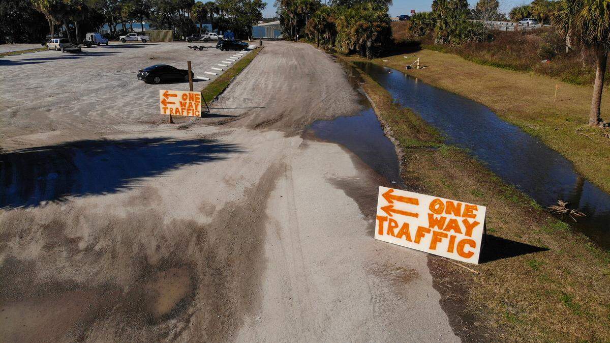 Rudimentary signs direct traffic into C.C. Haigh, Jr. Boat Landing as seen on Dec. 18, 2023, on Pinckney Island. Beaufort County is improving parking at the landing for the public ferry to Daufuskie Island until the county acquires land for the long term embarkation site at Cross Island Boat Landing on Hilton Head Island.