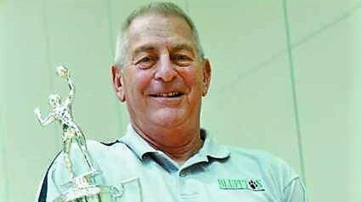 Al Stern with the 2007 Class AAA state championship trophy won by his girls’ team at Bluffton High School.