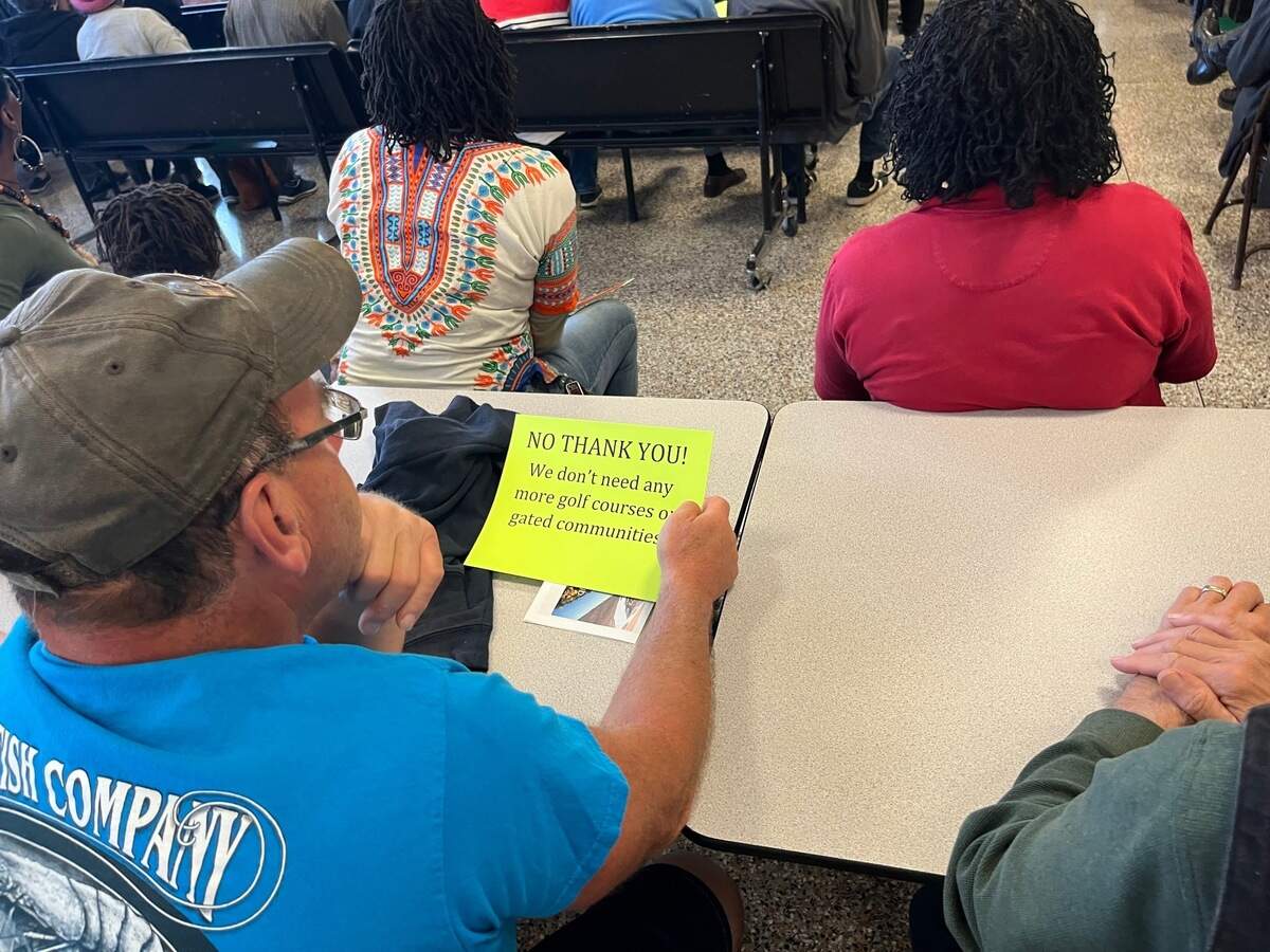 Residents attended a rally at St. Helena Elementary School Thursday to hear from speakers about a proposal to build golf courses and housing on the island.
