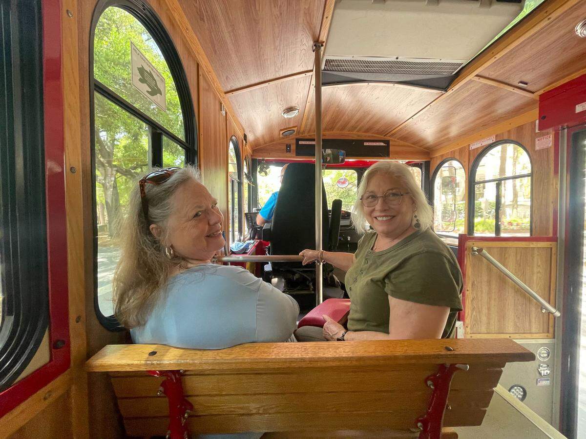 Karin Shore (left) and her cousin Beth Carroll (right) were instructed to park at the Shops at Sea Pines and take the trolley on their way to the Crazy Crab Monday afternoon. “It’s probably better than walking,” Carroll said.
