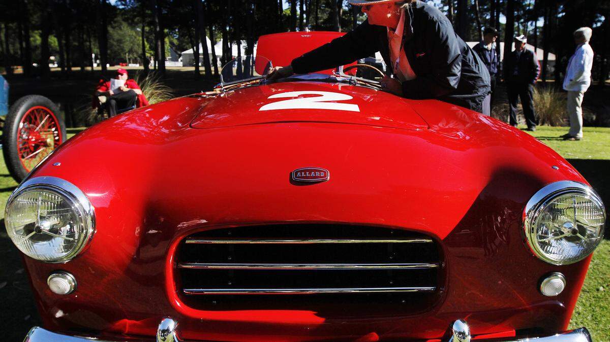 Hanko Rosenblad, of Yulee, Fla., dusts off the interior of a 1953 Allard Palm Beach on Sunday at the 13th annual Hilton Head Island Concours d’Elegance & Motoring Festival.