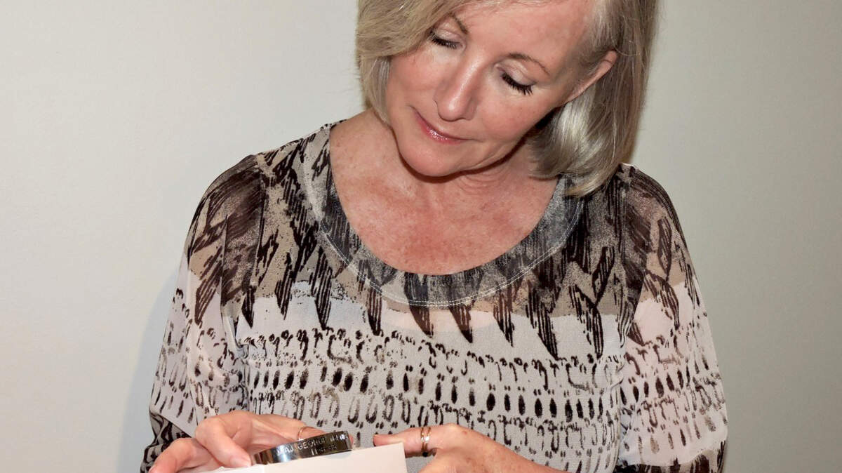 Jackie Adamski, a widow of an Army medic who wore a POW bracelet for USAF pilot George McKnight while serving in the Vietnam War, will mail the bracelet to the McKnight family for their safekeeping.