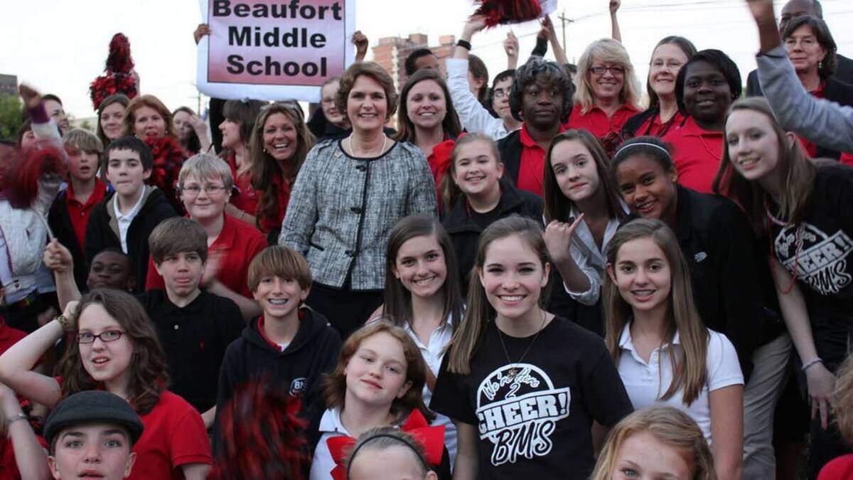 Beaufort Middle School principal Carole Ingram, center, celebrates with students and faculty when the school won the Palmetto’s Finest Award in 2012.