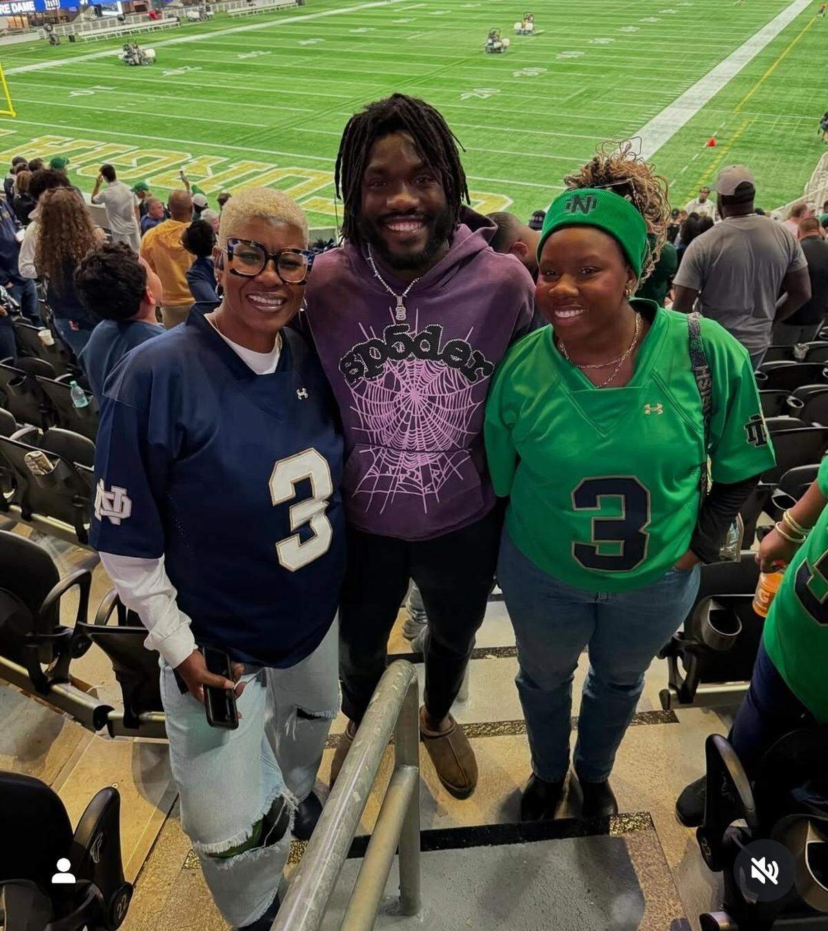 Jaylen Sneed poses with his mother, Chanta Ellison and sister Chynna Sneed before a Notre Dame game.