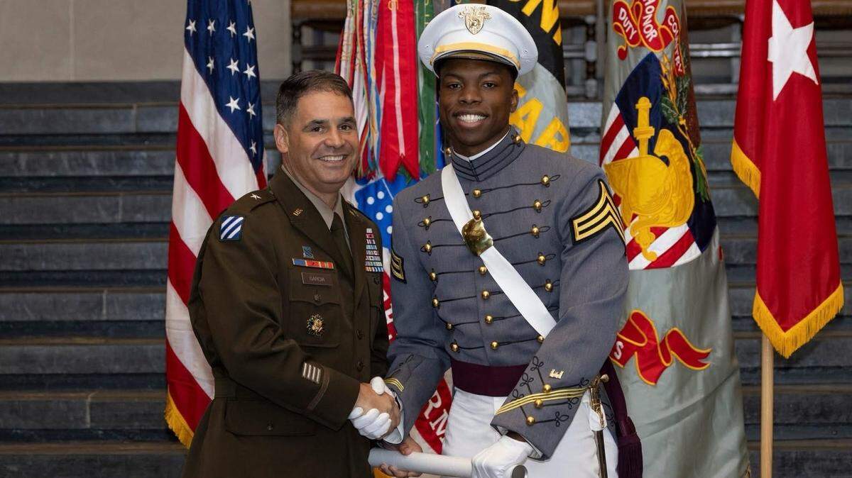 Brig. Gen. R. J. Garcia, commandant of the U.S. Military Academy at West Point, shakes the hand of Robert Alston Jr. of Sheldon following his graduation on June 13.