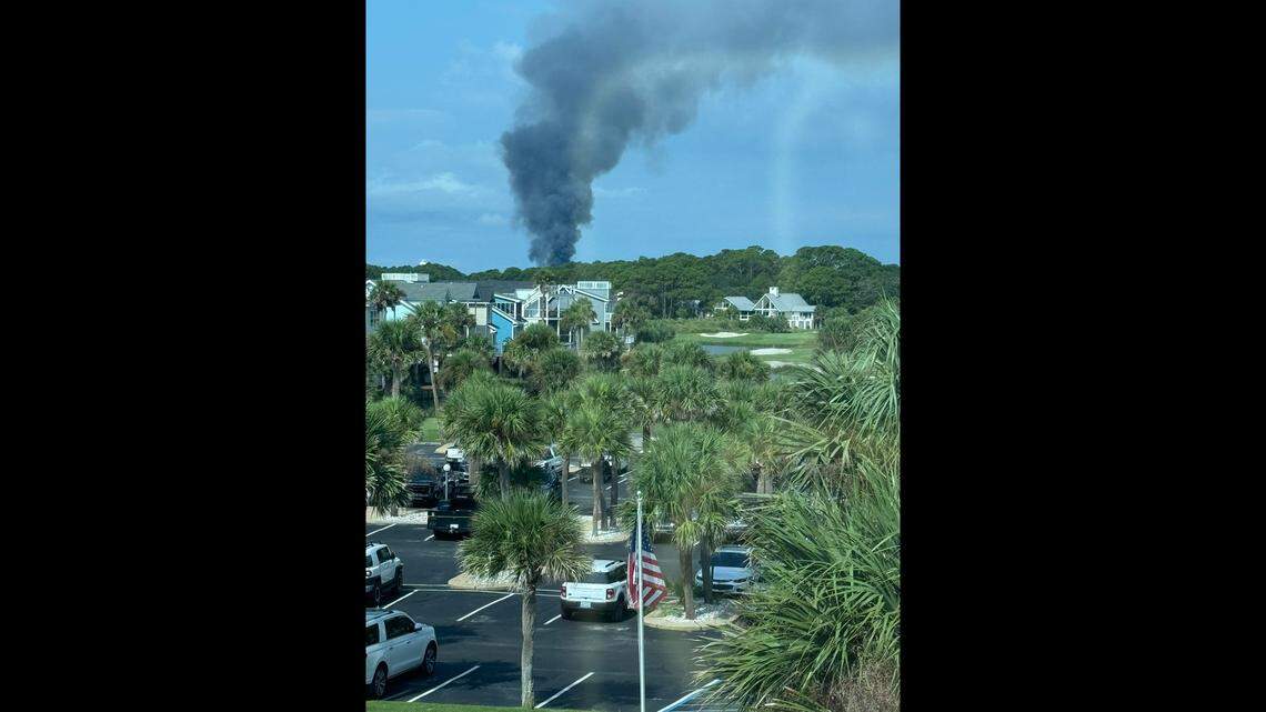 Smoke billows from houses during a Fripp Island fire Saturday.