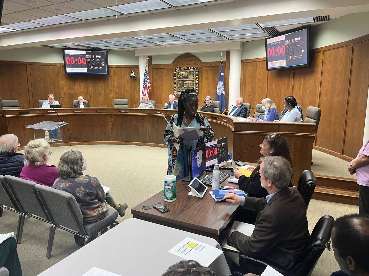 Queen Quet, chieftess of the Gullah/Geechee Nation, hands over a petition signed by more than 5,000 people opposing a proposed housing development and golf course on St. Helena Island during a meeting of the Beaufort County Planning Commission.