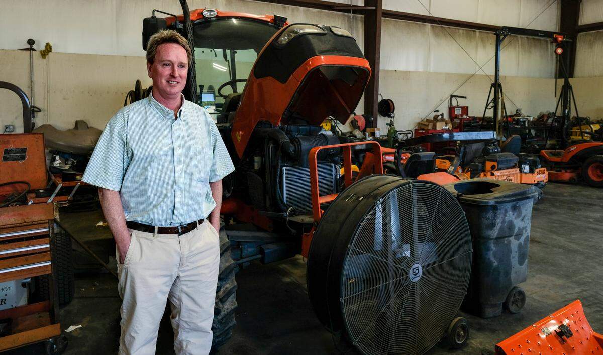 John Marvin Murdaugh, youngest brother of the embattled lawyer Richard Alexander Murdaugh, stands for a photo on March 4, 2022, in the repair shop at one of his businesses, Murdaugh Rental Center in Okatie. Murdaugh, who decided in his 20’s that he didn’t want to become a lawyer said he loves the outdoors. “I love tractors and big boy toys,” Murdaugh said as a line of fishing poles stood at the ready next to his desk.