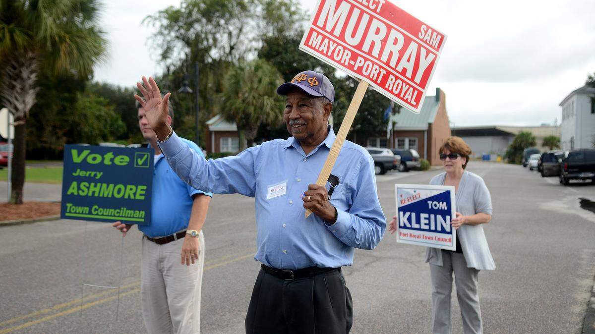 Port Royal mayor Sam Murray waves to passing cars while campaigning near the polling place at the Port Royal Town Hall on Election Day, Nov. 3, in Port Royal.  Murray won re-election.