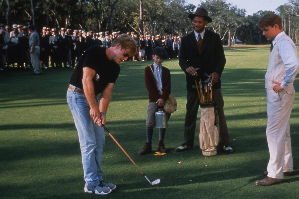 Robert Redford, who died Tuesday, lines up a shot during filming of “The Legend of Bagger Vance,” in 1999, as J. Michael Moncrief, Will Smith and Matt Damon look on. Golf course scenes were filmed at Colleton River Club in Bluffton and the Ocean Course at Kiawah Island.