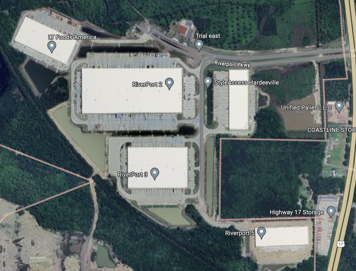 The cluster of warehouses making up the RiverPort Commerce Park is surrounded by a number of retention ponds.