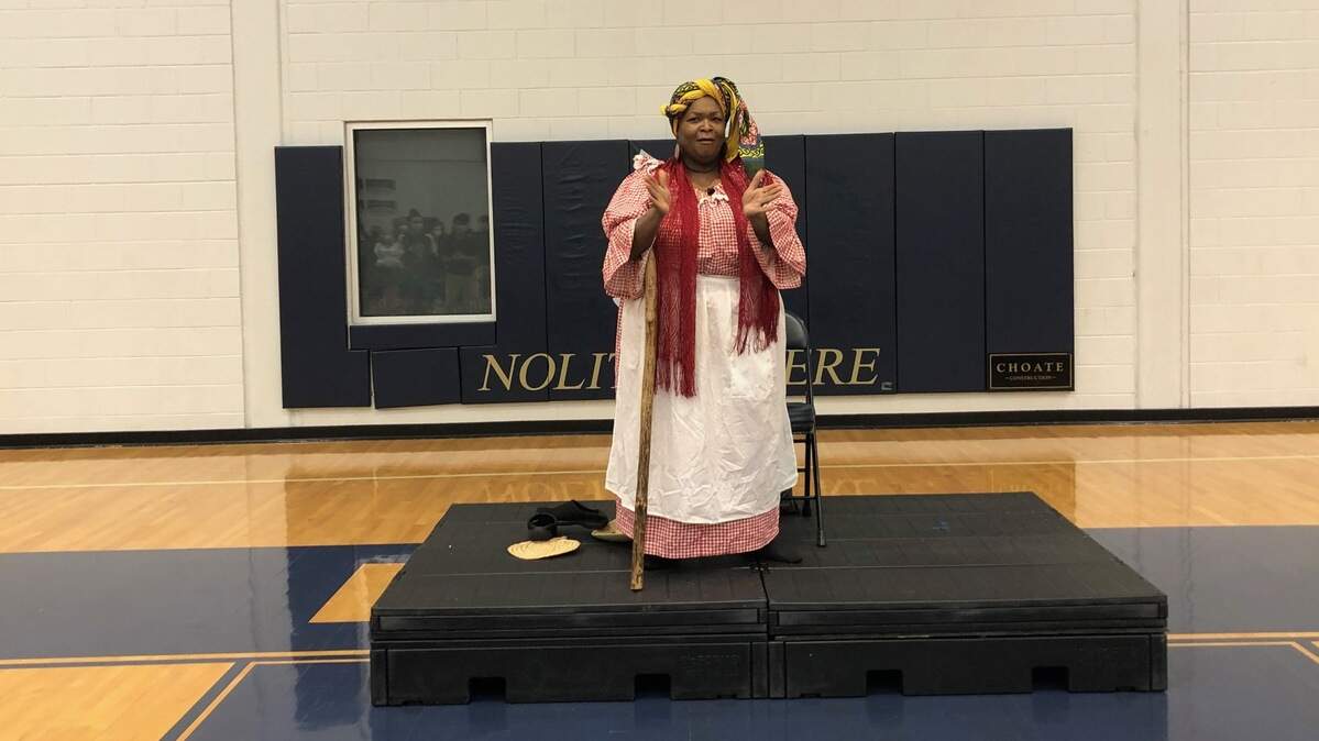 Anita Singleton-Prather leads the audience in song at John Paul II Catholic School in Ridgeland, S.C.