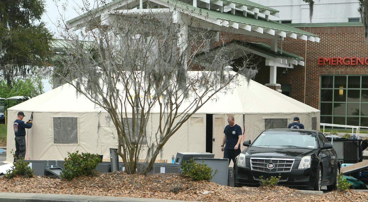 A tent is built in the parking lot of Beaufort Memorial Hospital on Monday, March 23, 2020 by the Charleston Fire Department.