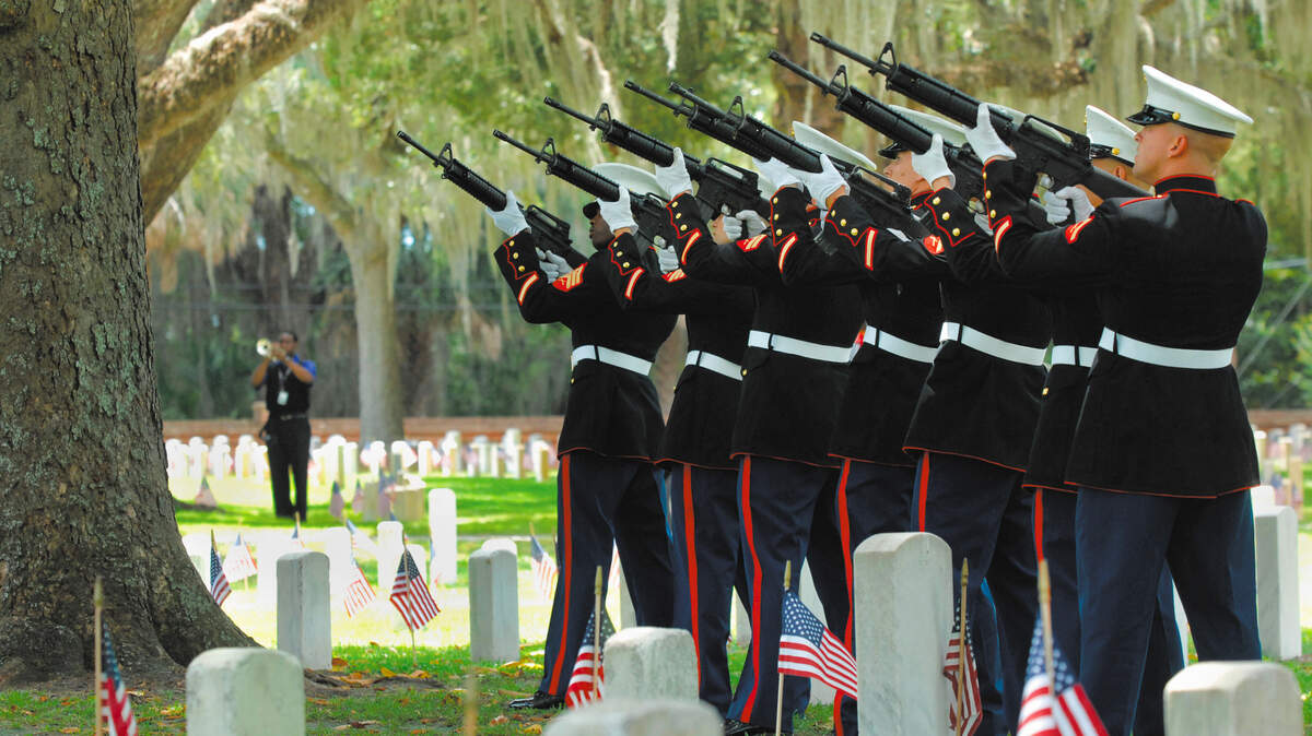 A detachment of Marines fires a 21-gun salute at the conclusion of a 2011 Memorial Day Ceremony at the Beaufort National Cemetery.