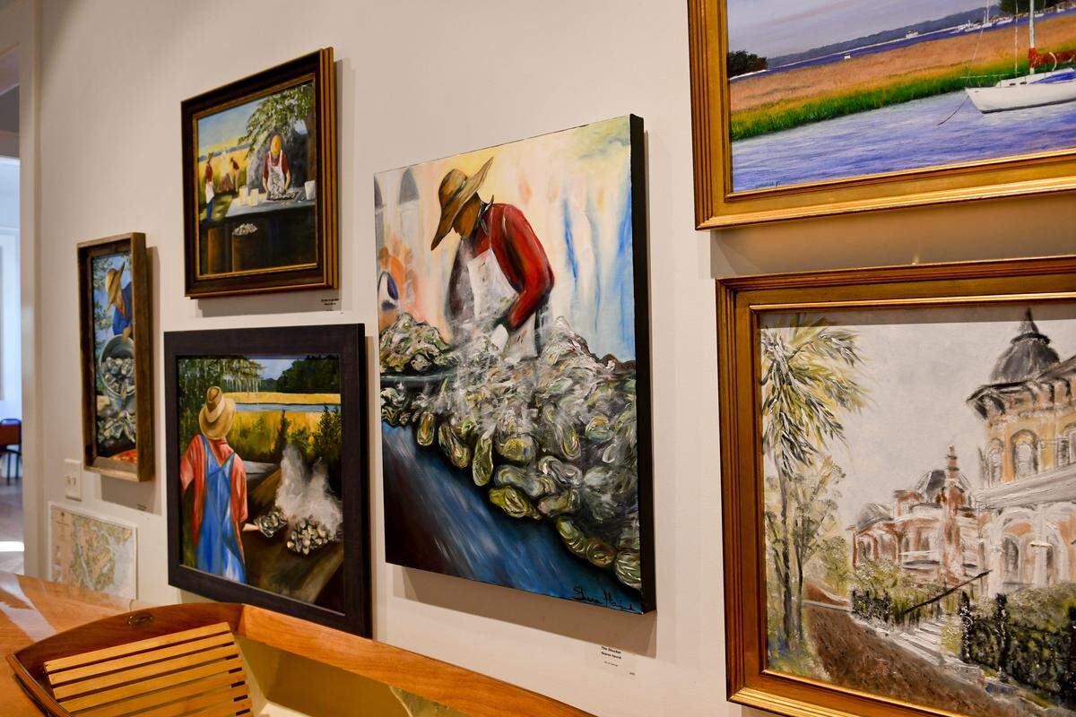 The colorful paintings of coastal life including “The Shucker,” created by Sharon Havrid as seen on Monday at the The Coastal Discovery Museum at Honey Horn on Hilton Head Island’s temporary exhibit of artists and artisans from Daufuskie Island.