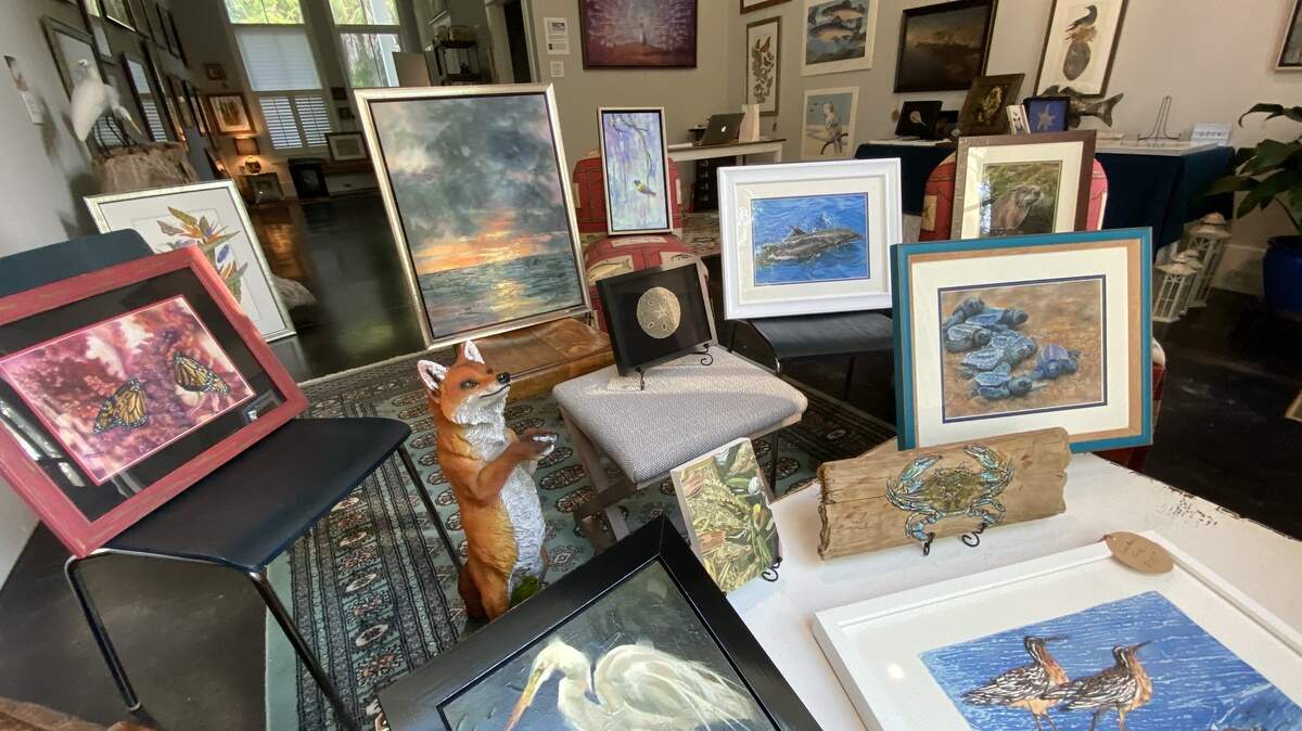 Robert Howell of the Mystic Osprey Gallery arranged a variety of pieces so they could be viewed at COVID-19 safety by passers-by looking through the large bay window at his Habersham gallery.