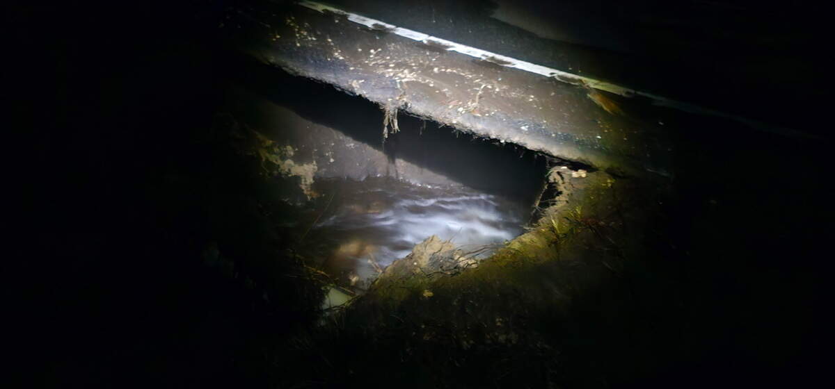 A suspected water main break washed out an area beneath Sams Point Road near the Coosaw River bridge early Wednesday. The break has reduced the road to one lane in the area and temporarily cut water service to Coosaw Island residents.