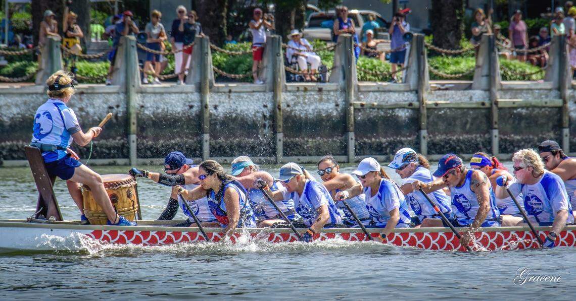 A drum is used to set the paddling pace during dragon boat racing.
