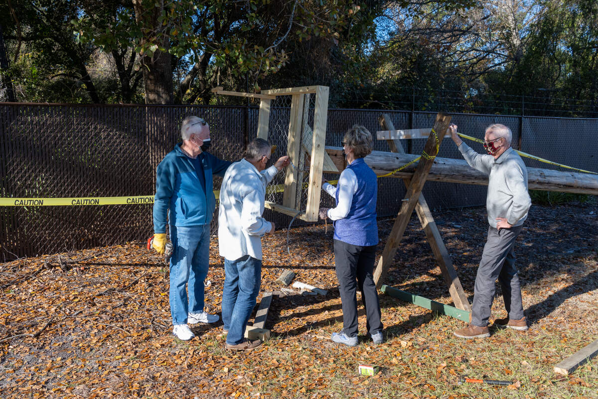 Members of Palmetto Hall’s bird committee work to affix a platform they hope will be used by nesting ospreys in the spring of 2021 to the top of a 44-foot telephone pole that was raised on Dec. 23, 2020 on Hilton Head Island.