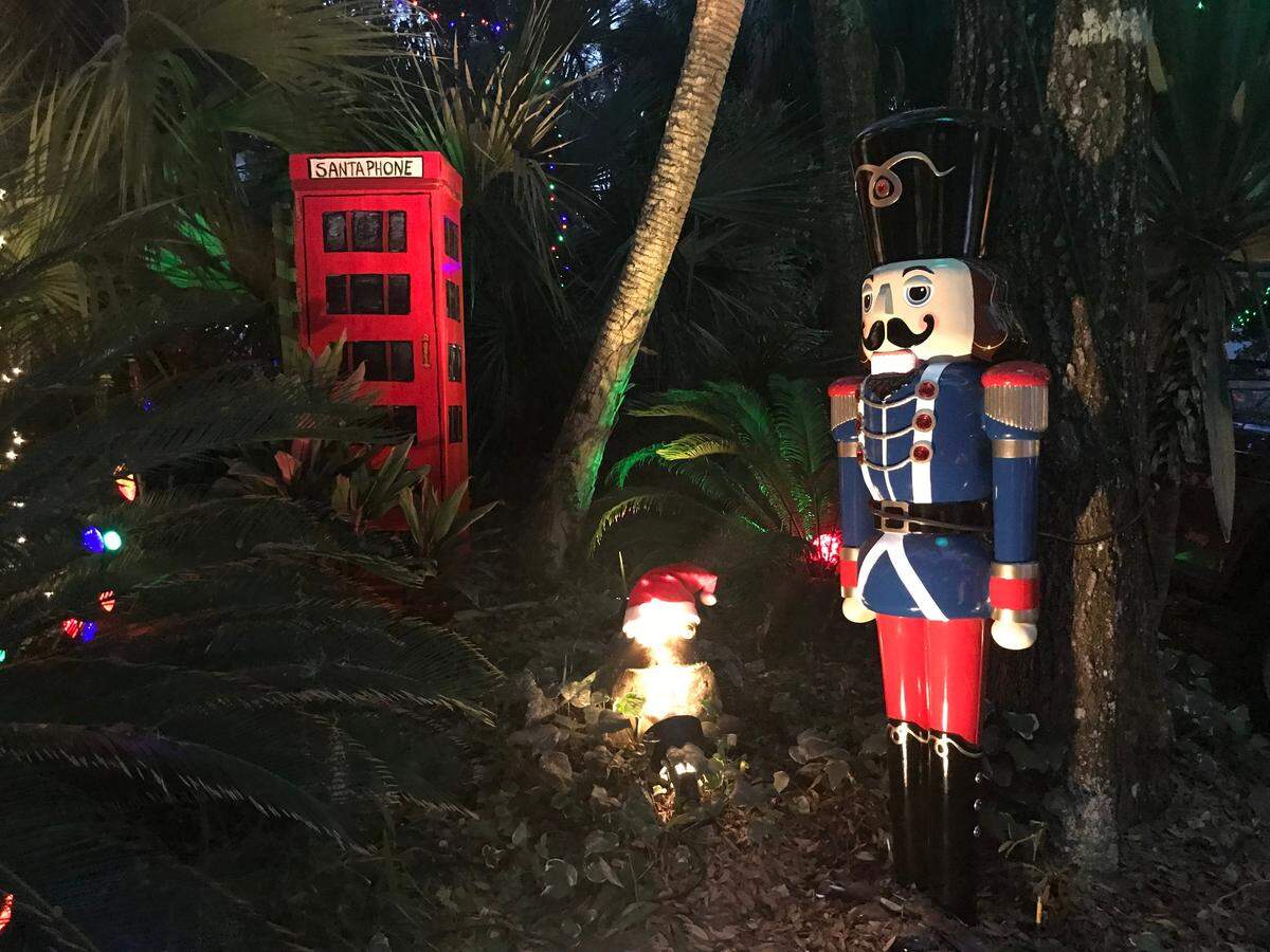 A six-foot nutcracker and a Santa phone booth crafted from his box are among the lights on Hilton Head’s Dove Street.