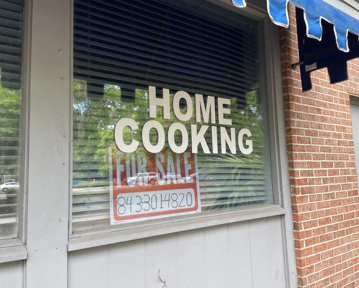 “For sale” signs sit inside the windowsill of the vacant building that formerly held Stack’s Pancakes & More for two decades