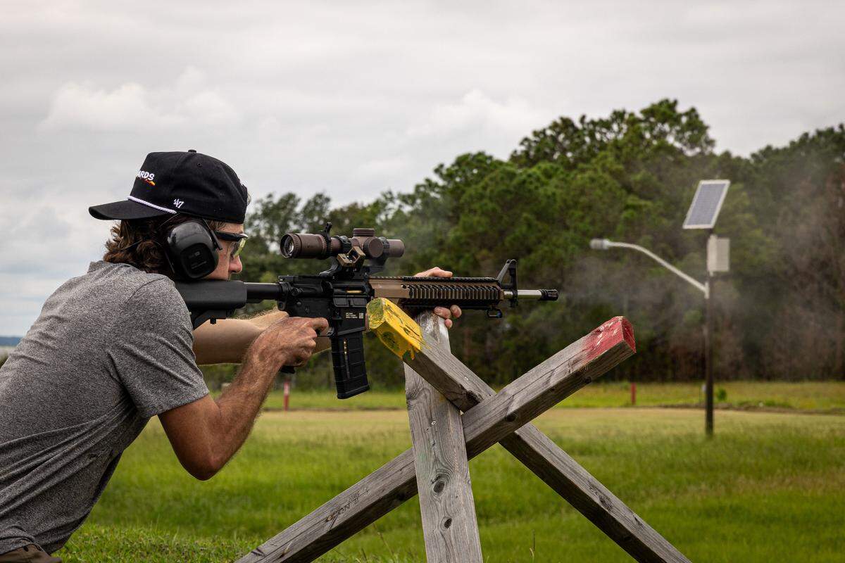 Team Penske NASCAR drivers Ryan Blaney fires a rifle at the shooting at Marine Corps Recruit Depot Parris Island Thursday.