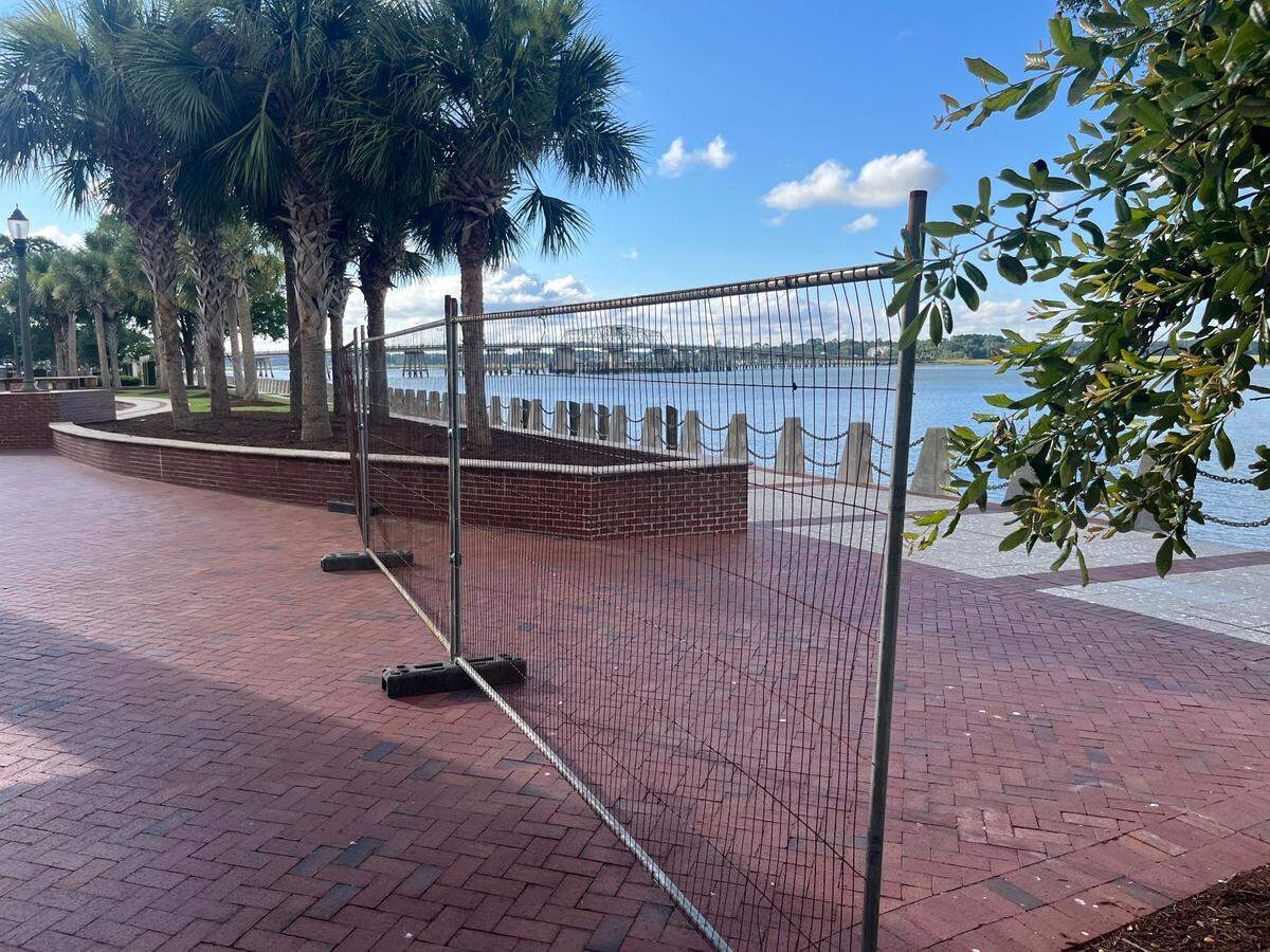 A fence prevents people visiting Waterfront Park in Beaufort from accessing the promenade along the Beaufort River.