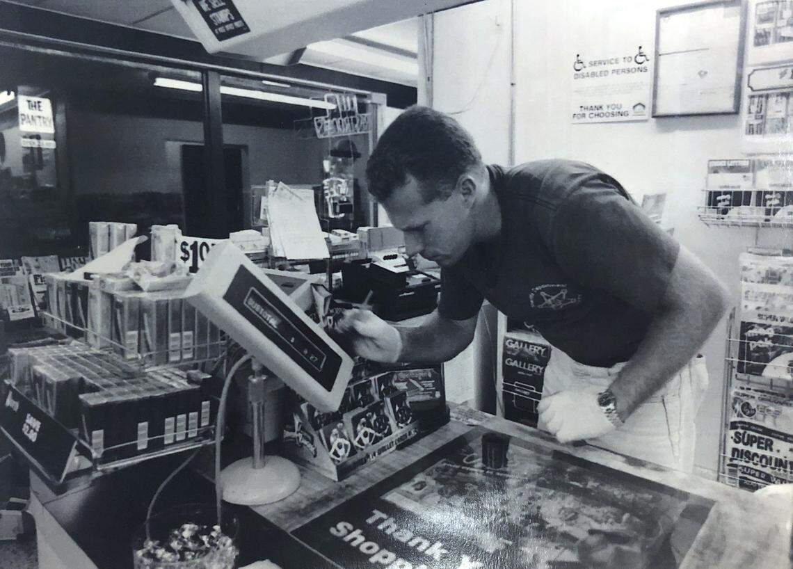 In this file photo from 1994, Detective Bob Bromage, with the Beaufort County Sheriff’s Department, dusts for fingerprints at a convenience store on Hilton Head Island where a clerk was murdered. Bromage, now a major with the sheriff’s office, is the lead detective for the department’s unsolved murder cases.