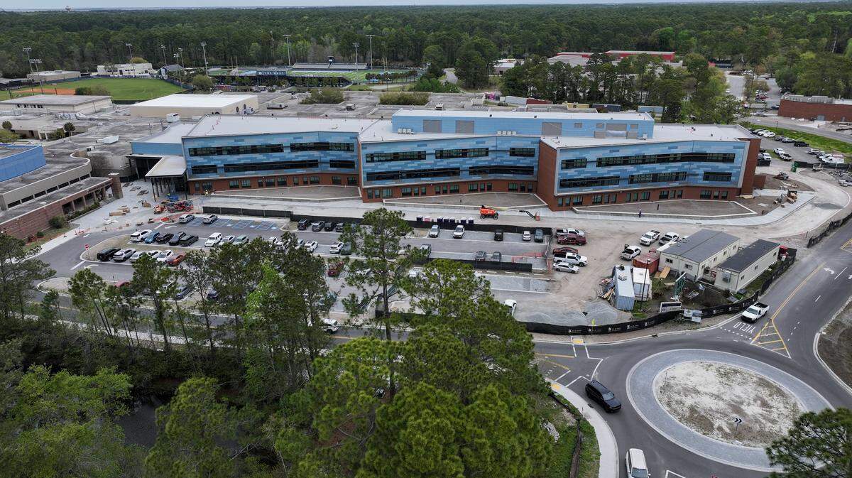 A drone photo of the new, three-story Hilton Head Island High School as photographed on March 24, 2026, on Hilton Head. The original high school, which will be demolished at the end of the school year, is directly behind the new construction.