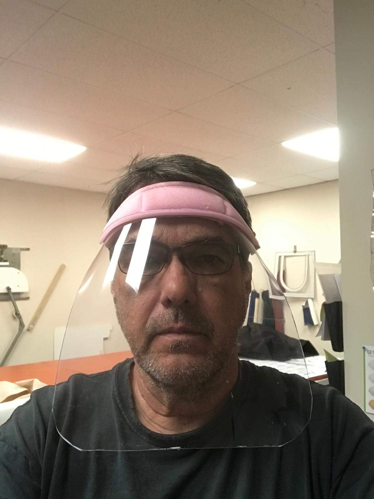 Leonard Davidson shows a face mask he made from boat cover materials in his Okatie/Bluffton shop. He and Jim Springer have made made and donated about 150 shields to health care workers during the coronavirus outbreak.