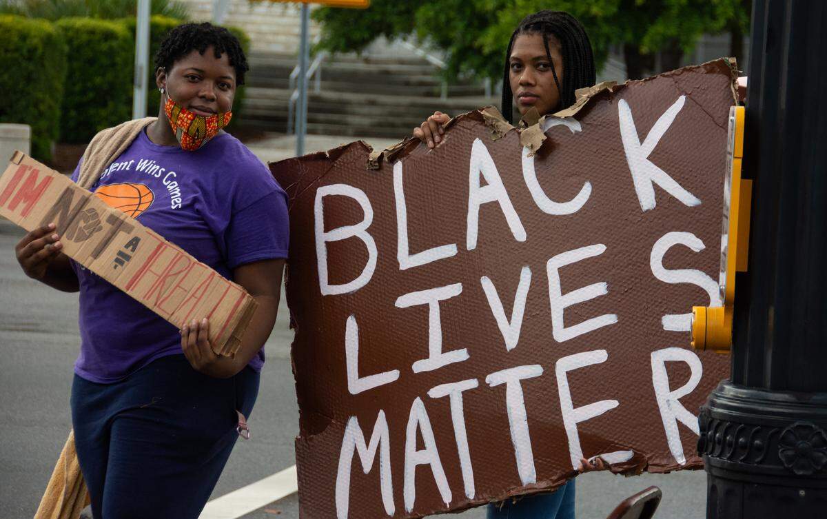 Protesters gathered at Ribaut Road and Boundary Street in Beaufort on Sunday, May 31, 2020, against institutional racism and police brutality across the nation.