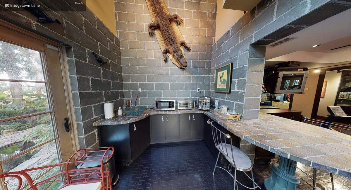 The guest house at 80 Bridgetown Lane features a large taxidermy display. The home, not including its furnishings, is listed for sale at $12.5 million.