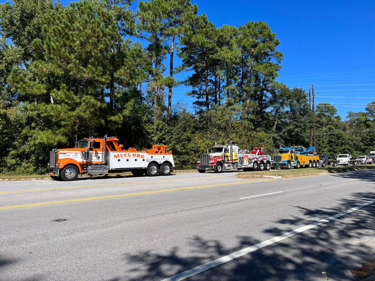Over 50 tow trucks lined the shoulder of Simmonsville Road Tuesday afternoon outside the funeral for tow truck owner Thomas “Tommy” Burrows who died Saturday at the age of 53.