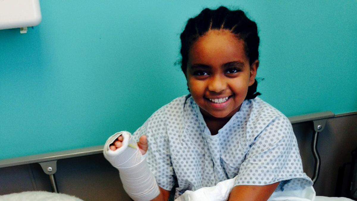 Meti Kershner, 9, on the road to recovery with a new friend in an Atlanta hospital after suffering an apparent shark bite while playing in the surf off the Shipyard Beach Club on Oct. 9.