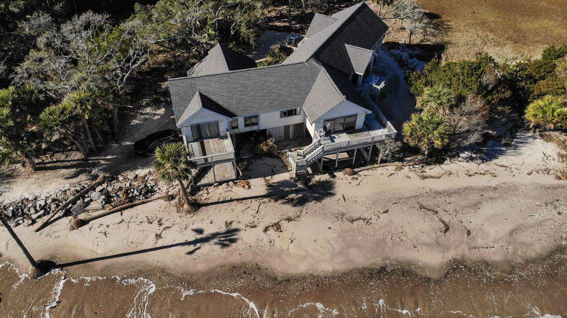 Photographed with a drone on Jan. 30, 2024 at high tide of a mere 5 feet above sea level shows waves lapping just yards from Jerry and Vivian Wayne’s peninsula home in Coffin Point on St. Helena Island. The Waynes have experienced substantial erosion of their property that they believe has been accelerated by seawalls erected by other estuarine land property owners near them.