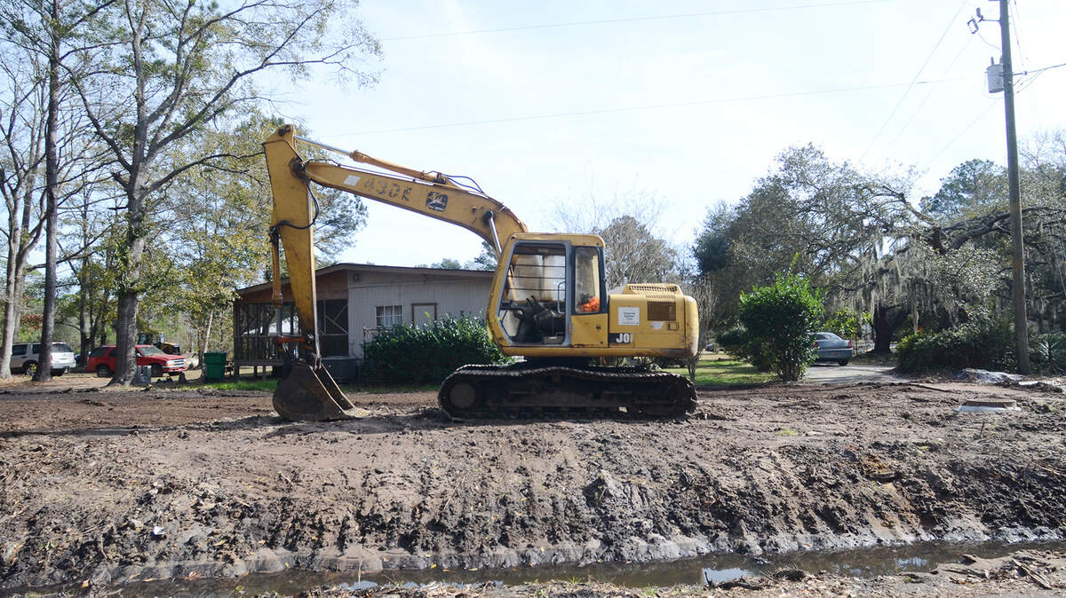 An excavator sits at the corner of Buck Island Road and Kitty Road in Bluffton on Monday, where work to install sewer lines is occurring.