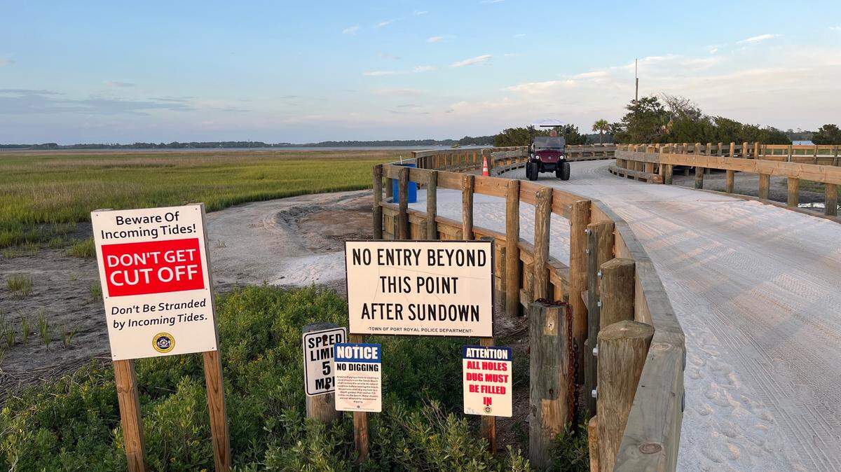 A golf cart passes on a causeway at Sands Beach in Port Royal. The town allows nighttime driving of golf carts as long as they have the proper lights. The city of Beaufort just past new golf cart regulations that also allow golf carts to be operated at night. 